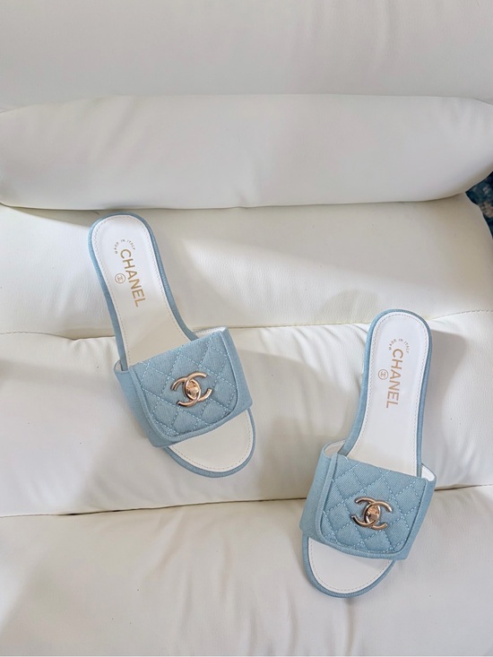 CHANEL Shoes - CHANEL Powder Blue Quilted Slide Mules with Gold CC Emblem - Size 38